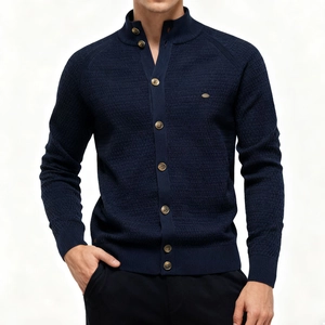 Detail of navy knit cardigan with stand collar and textured waffle weave fabric