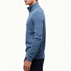 Detail view of smog blue half-zip sweatshirt featuring a stand collar and ribbed cuffs
