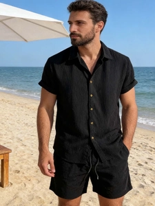 Close-up of black men's casual seaside set featuring textured seersucker and amber buttons
