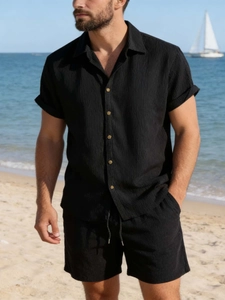 Men's summer black seersucker two-piece set featuring short sleeve shirt and beach shorts