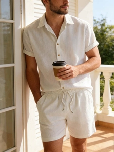 Men's white summer two-piece casual set featuring a short sleeve shirt and drawstring shorts
