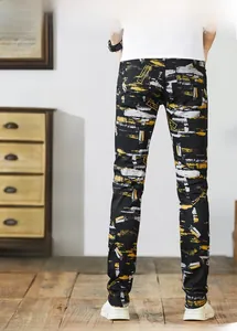Back view of men's slim fit black jeans with yellow abstract paint brush prints