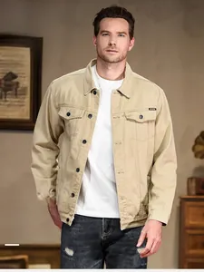 Classic khaki men's denim jacket detail with flap chest pockets and button-down front