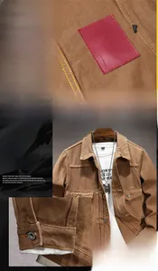 Detailed close-up of brown workwear jacket featuring a red leather label and metal buttons
