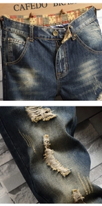 Détails de jeans vintage avec effet délavé, déchirures usées et doublure de taille à motifs
