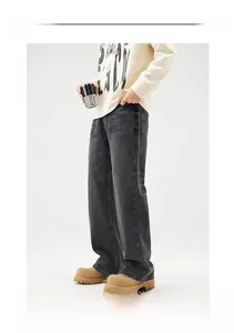 Detail der vintage gewaschenen weiten Jeans in Dunkelgrau im Retro-Streetstyle-Look