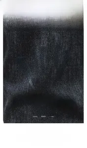 Detailed macro view of high-quality denim fabric texture showing soft weave
