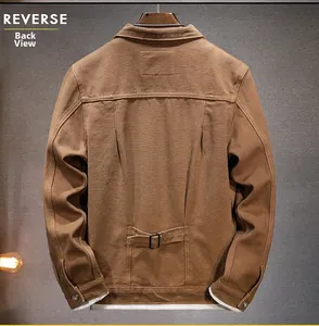 Detail view of the brown utility jacket back featuring adjustable waist straps and cotton fabric