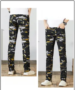 Front and back detail of men's slim fit casual pants with yellow paint splatter print