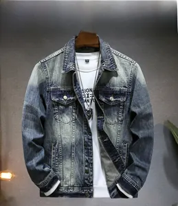 Detail of vintage washed denim jacket with distressed textures and flap chest pockets
