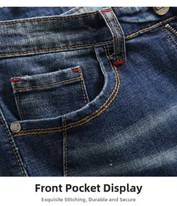 Close-up of front pocket on deep blue jeans with yellow stitching and metal rivets
