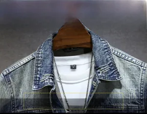 Detailed close-up of retro denim jacket collar featuring distressed finish and lapel design