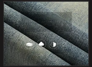 Gros plan du tissu denim extensible haut de gamme montrant la texture sergé et le délavage bleu