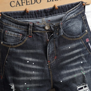 Herren Slim Fit Jeans in Dunkelgrau mit Farbspritzern und modischen Rissen