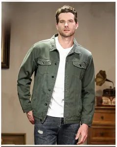 Detail of army green denim jacket showing metal buttons and front chest pockets