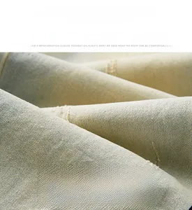 Detailed macro view of high-density stretch denim fabric with twill texture and soft finish