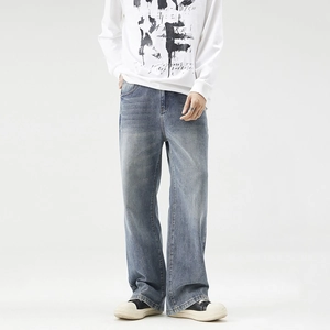 Men's loose straight leg jeans in vintage washed light blue denim for a relaxed fit
