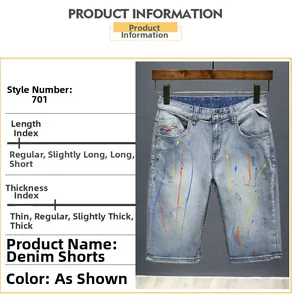 Detail of light blue denim shorts featuring colorful paint splatter and vintage finish