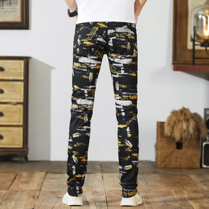 Men's high street slim fit black jeans featuring yellow graffiti prints and LSKB design