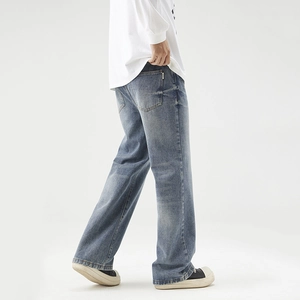 Men's baggy straight-leg vintage washed blue jeans in a retro loose-fit streetwear style