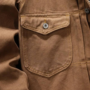 Men's vintage workwear jacket in brown heavy canvas with double-stitched pocket and metal button