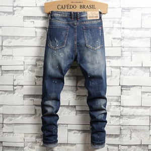 Slim fit dark blue men's jeans with vintage wash and multi-color paint splatter detail