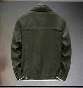 Detail view of dark green denim jacket back featuring workwear style seams and metal buckles
