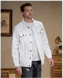 Close-up of white denim jacket with classic flap pockets and button-down front for men