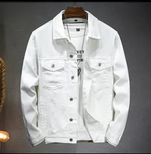 Close-up of white denim jacket with flap chest pockets and metallic buttons