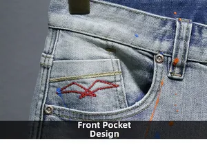 Detail of light blue denim shorts with red gull embroidery and multi-color paint splatter