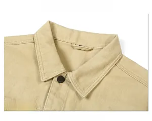 Detailed close-up of khaki denim jacket collar featuring high-density twill fabric