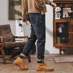 Men's deep blue raw denim straight leg jeans in a vintage American workwear style