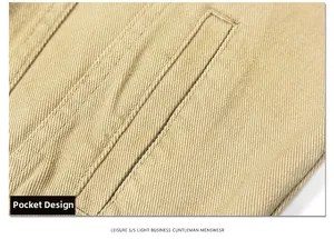 Detail of khaki twill jacket pocket with neat stitching and heavy fabric texture
