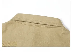Detailed view of the khaki cotton twill fabric and stitching on men jacket neckline
