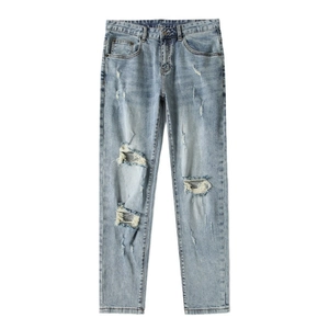 Slim fit light blue distressed jeans for men with ripped knees and whiskers texture