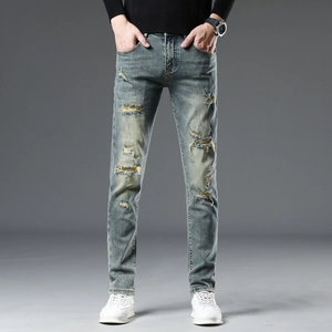Jean slim pour homme avec effet délavé bleu et détails déchirés tendance
