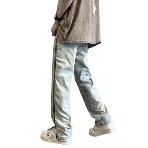 Men's retro light blue washed flared denim jeans with black side stripes and raw hems