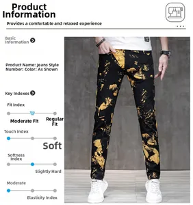 Dettaglio dei jeans neri slim con vivaci graffiti gialli e motivi a macchia di inchiostro