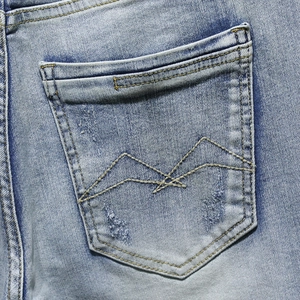 Men's vintage light blue washed denim shorts with paint splatter and embroidery details