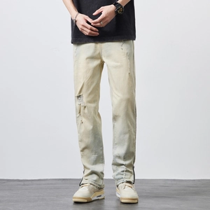 Men's high street distressed yellow wash jeans with side zippers and ripped details