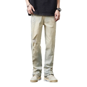 Men's vintage distressed streetwear jeans with ripped details and a straight flare fit