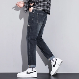 Slim fit dark blue men's jeans with stylish side graphic print and cuffed leg openings