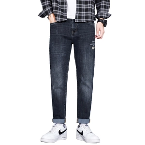 Slim fit men's dark gray snow wash denim jeans with small embroidery and rolled cuffs