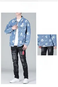 Detail showing printed denim jacket with bear patterns and black pants with red scissor embroidery