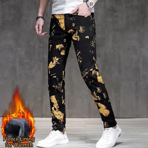 Men's black slim fit jeans with gold spray print and warm fleece lining for winter wear