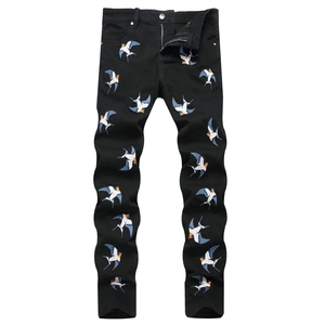 Men's slim fit black denim pants with colorful swallow embroidery and classic 5-pocket design