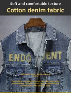 Detail of deep blue denim vest featuring chest embroidery and raw edge finish