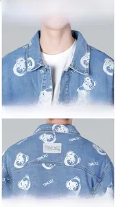 Detailed close-up showing light blue denim jacket with bear print and collar texture