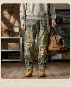 Detailed view of distressed vintage jeans with heavy patchwork and washed texture