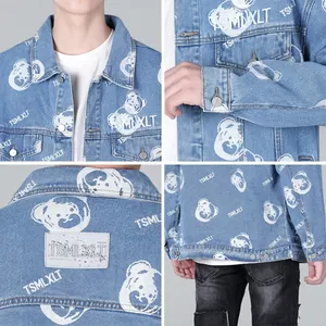 Blue denim jacket with bear cartoon print and metal buttons in a relaxed streetwear style